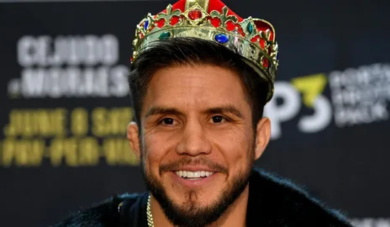 Henry Cejudo smiling during media appearance