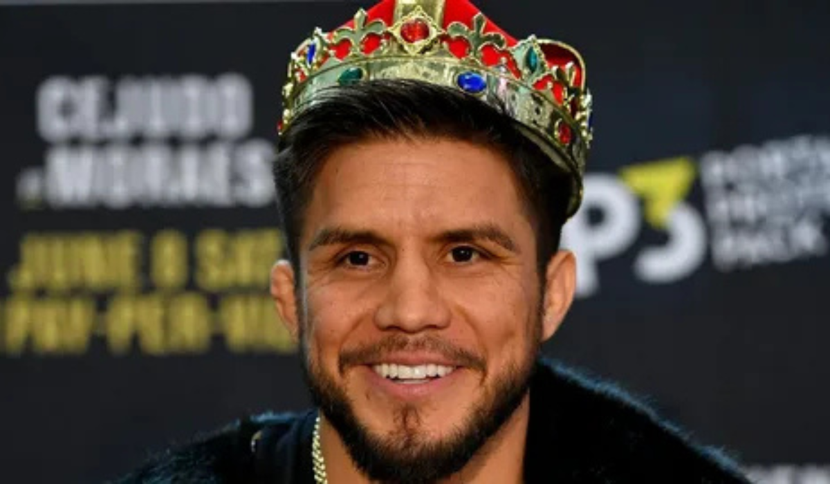 Henry Cejudo smiling during media appearance