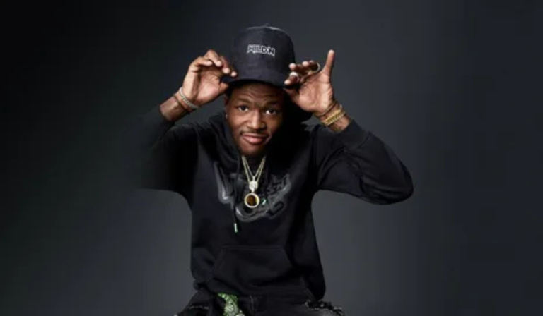 DC Young Fly entertaining audience with comedic performance