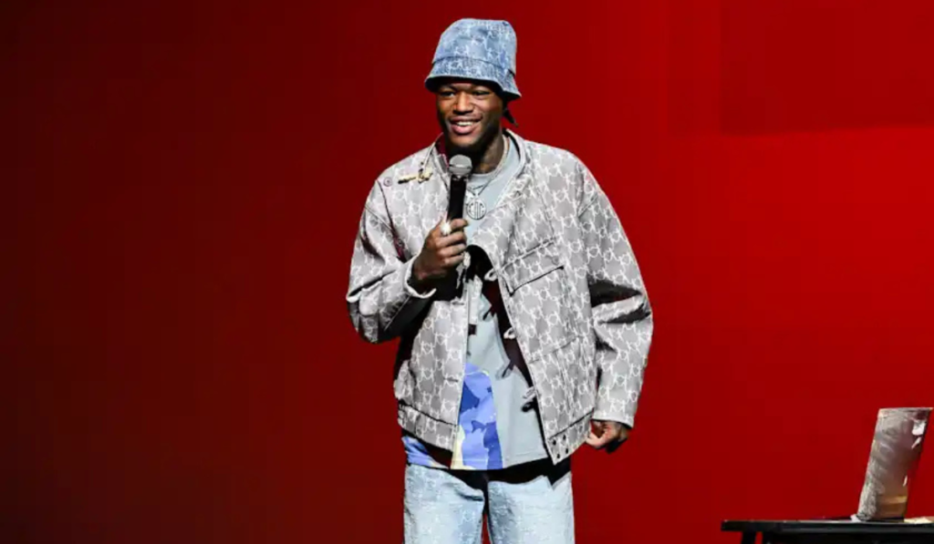DC Young Fly at an event highlighting his rise in comedy and wealth on mike