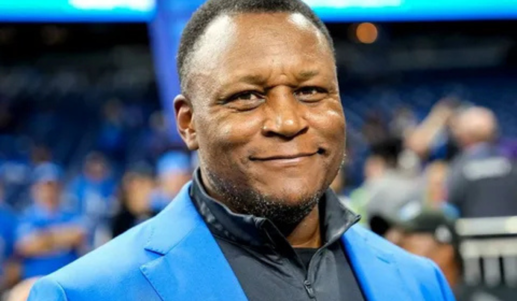 Barry Sanders smiling during an event, highlighting his net worth and NFL lega