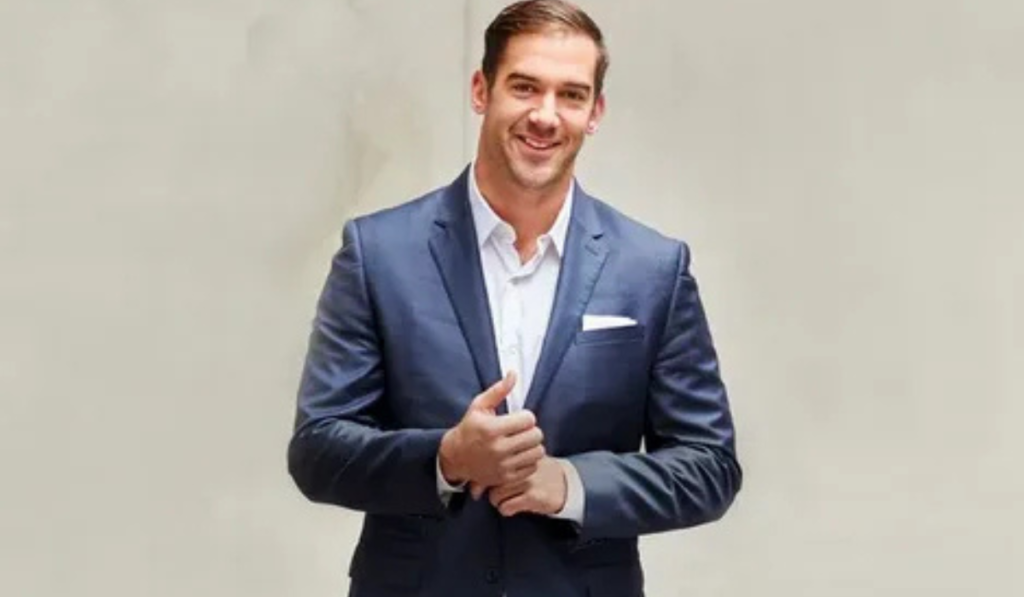 Lewis Howes net worth featuring Lewis Howes as a successful entrepreneur, podcast host, and author highlighting his income and business journey.