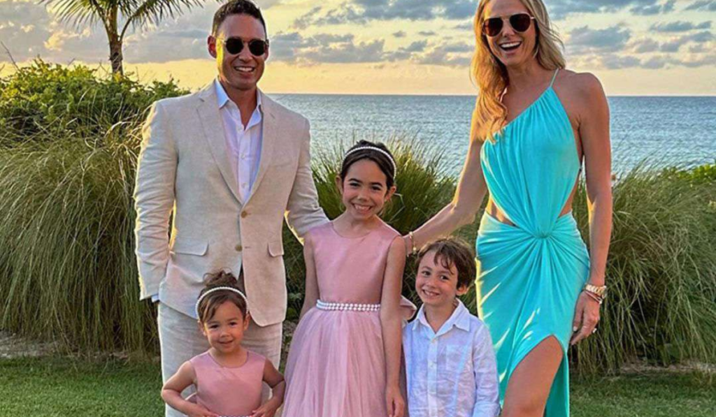 Stacy Keibler posing with her family at a public event, featured in an article about Stacy Keibler net worth, lifestyle, and personal life.”